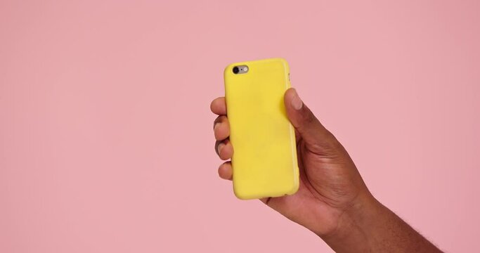 African american man hand demostrate phone isolated on pink background