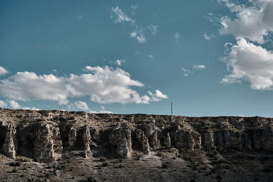 Fairy chimneys and geologic and natural stones in valley with blue sky and dessert in Turkey