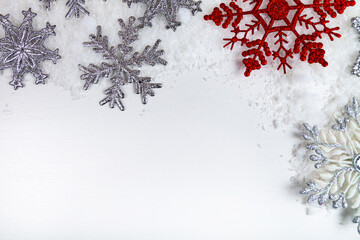 Border of snowflakes in the snow