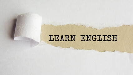learn english. words. text on gray paper on torn paper background