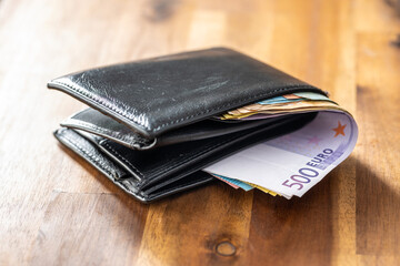 Leather wallet and euro money.
