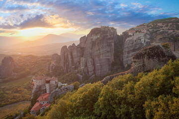 Beautiful sunset in Greece. Meteora Rocks, Kalampaka, Monastery and sunset sky clouds
