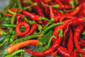 Background with bitter pepper. Colorful pods of bitter pepper. Chili pepper. Agricultural background with vegetables. Harvesting. Sale of vegetables. Agricultural business.