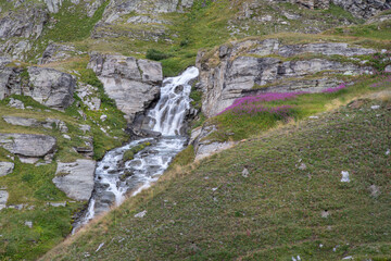 Waterfall in a mountain landscape in the Alps in France in summer