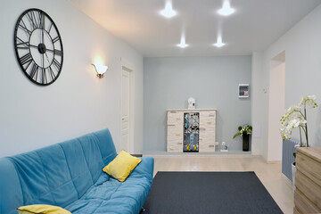 Interior of the living room with electric wall fireplace