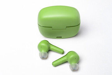 green bluetooth headphones in a box