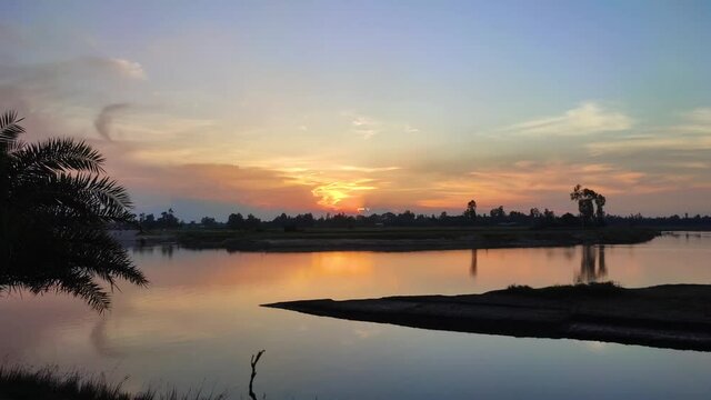 Sunset on the bank of river.Water flowing in the river in bangladesh.