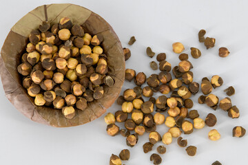 Selective focused Indian health snack roasted chickpeas with salt on an isolated white background. Cooked without oil and very healthy daily snacks, Tamilnadu, Mumbai, Delhi, Kerala.