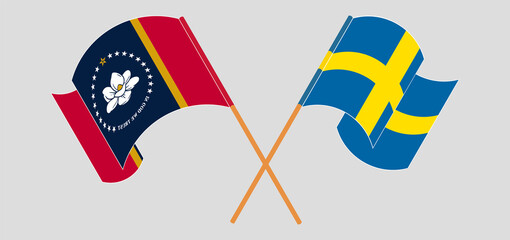 Crossed and waving flags of The State of Mississippi and Sweden