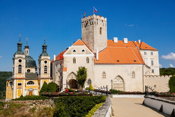 Vranov nad dyji, Southern Moravia, Czech Republic, 03 July 2021: baroque and gothic medieval castle with Chapel of the Holy Trinity on hill at sunny summer day, stone tower against the blue sky