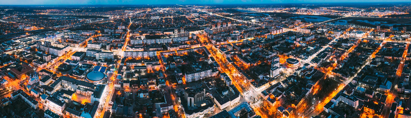 Brest, Belarus. Cityscape Skyline In Evening Illuminations. Night Bird's-eye View Of Brest Market And Pedestrian Sovietskaya Street. Panorama, Panoramic View