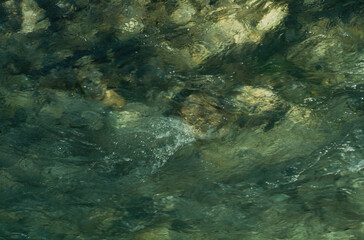 Naklejka na ściany i meble river flowing over rocks