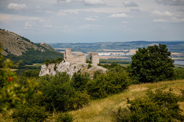 Fototapeta na wymiar Klentnice, South Moravia, Czech Republic, 05 July 2021: ruins of medieval Orphan's castle or Sirotci hradek, St. Jacob's Way at sunny summer day, gothic fortress, stronghold on hill, Palava region