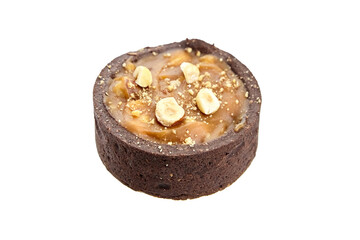 Mini caramel tart with hazelnuts isolated on white