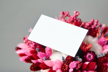 Business card or invitation mockup and dried flower bouquet