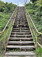 Old rusty stairway outdoors in the grass