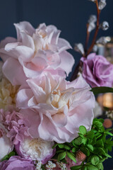 Beautiful flowers. Preserved roses with dried flowers bouquet closeup. Beautiful flower arrangement in a pink box.