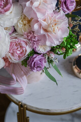 Beautiful flowers. Preserved roses with dried flowers bouquet closeup. Beautiful flower arrangement in a pink box.