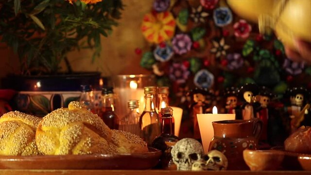 authentic Mexican guaje serving mezcal in a traditional Mexican offering for Day of the Dead celebration in Mexico. (Dia de muertos)