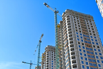 Crane and highrise construction site