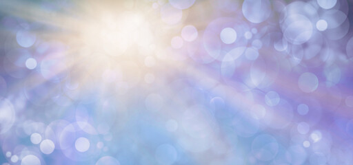 Blue Bokeh and golden light flash background - bright gold sun light beaming from top left against blue purple bokeh background with space for messages and text

