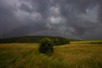 Double Rainbow during Sun high in the sky