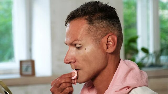 Close up of Male doing make up- Lgbt, gay, trendy concept 