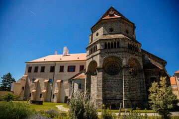 Fototapeta premium Trebic, Bohemia, Czech Republic, 06 July 2021: medieval castle with museum in historic center, St. Procopius basilica and monastery Romanesque Gothic style, Benedictine herb garden, sunny summer day