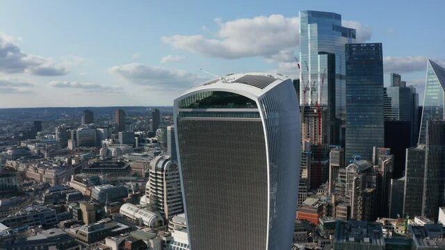 Aerial view of new modern tall office buildings in City district. Sky garden on top of The Walkie Talkie skyscraper. London, UK