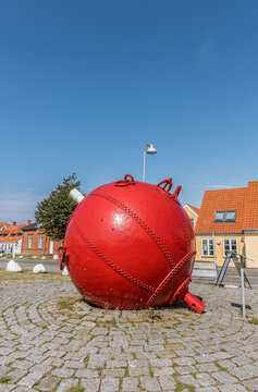 a red buoy lying on the square