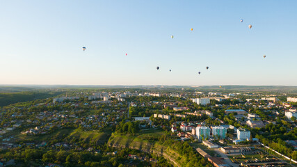 How to travel during quarantine. Hot air balloon. Colorful hot-air balloons flying over the city