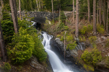 Paradise river and bridge near Narada Falls at Mount Rainier National Park in Washington State during summer.