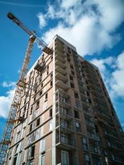 Fototapeta na wymiar Construction concept. Tower cranes in the construction of high-rise buildings.