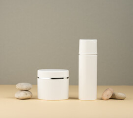 jar, empty white plastic tubes for cosmetics on a yellow background. Packaging for cream, gel, serum, advertising and product promotion, mock up