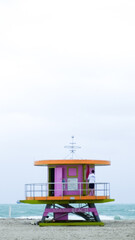 One of the iconic lifeguard towers of Miami Beach, this one in pink, green, and orange.