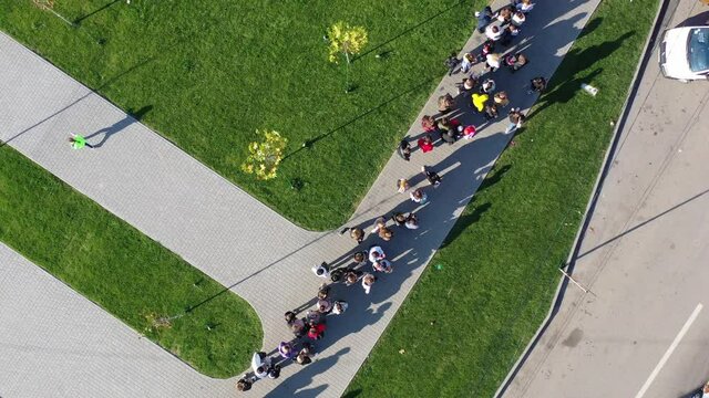 A long queue of people in the store waiting for a purchase. Sale Black Friday 