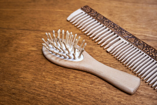 Wooden hair combs lie on the table