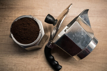 Caffettiera filled with coffee in a kitchen with nice lighting from above