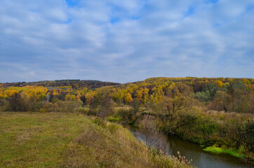 autumn landscape with river and forest