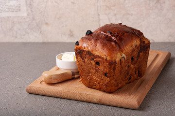 airy cupcake with raisins on a wooden board