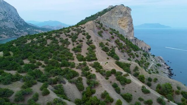 Sea in crimea trail Galiyna quadcopter from the air blue sky mountains grass trees vacation nature coastline, ea beautiful hill green, clouds. Blue beach, cliffs sea top view crimea mountain