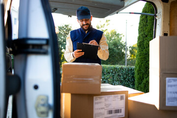 Delivery worker checking parcels before delivering to the location.