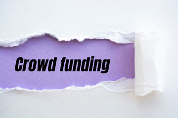 Crowd Funding written under torn paper.