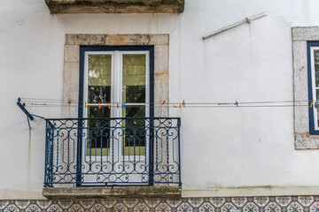Obraz premium Traditional residential facade with a small balcony