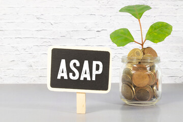 The word asap laid with silver metal letters in center of painted classic blue flat board.