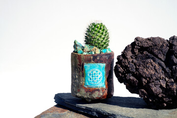 Cactus with lava stone and Chrysocolla blue rocks. 