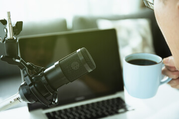 Unrecognizable Asian young man making a home podcast.