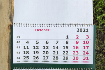 Planning a business calendar for October 2021 paper wall business concept