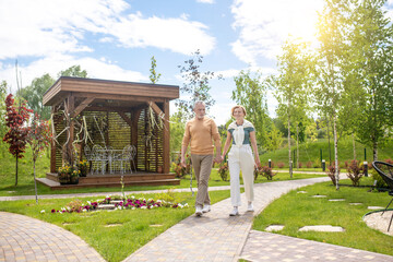 Romantic married couple strolling in a recreation park