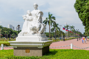 white statue of women and girls at José Rizal Park in ermita